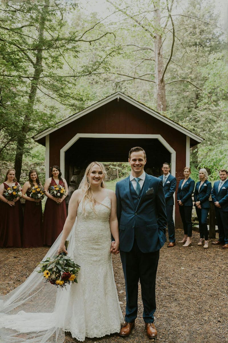 Rustic Wedding with the entire wedding party in coordinating suits