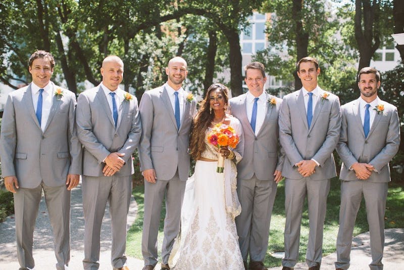 groomsmen in gray suits and brown shoes