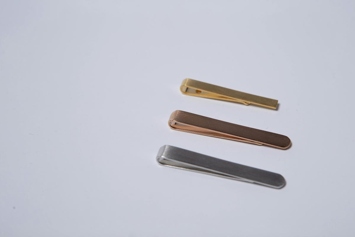 Men's wedding accessories_ how to wear tie bars with wedding suits